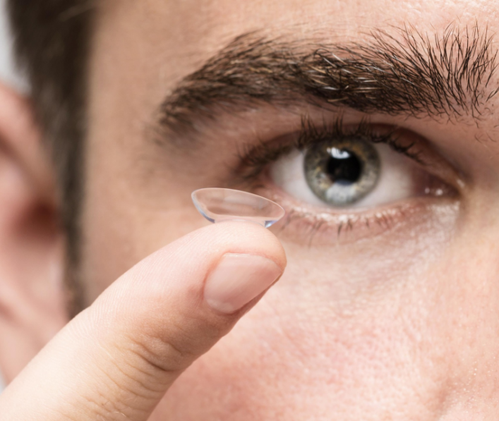 person putting in contacts at vision edge eye center